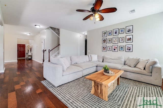 living room with dark hardwood / wood-style floors and ceiling fan