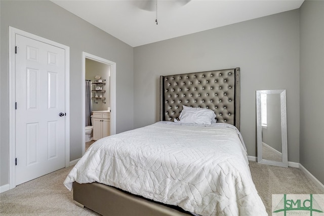 carpeted bedroom with ensuite bath