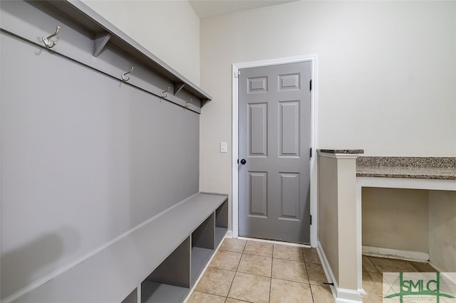 mudroom with light tile patterned floors