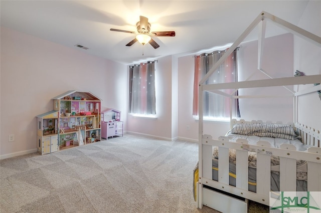 carpeted bedroom featuring ceiling fan