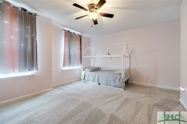 unfurnished bedroom featuring ceiling fan and light carpet