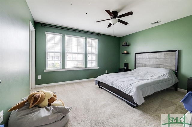 carpeted bedroom with ceiling fan