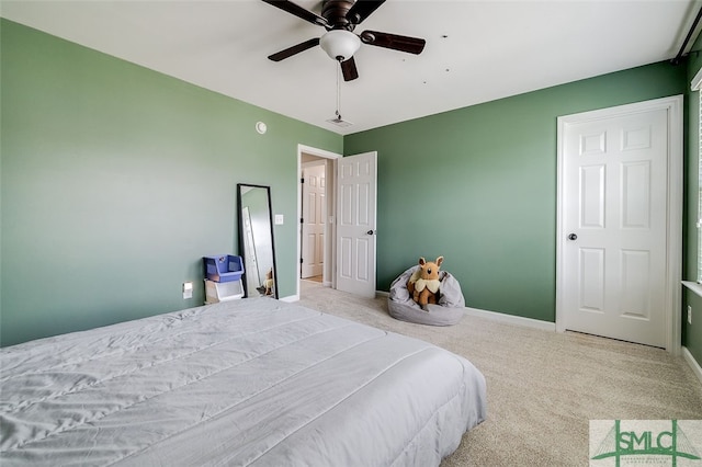 bedroom with ceiling fan and light colored carpet