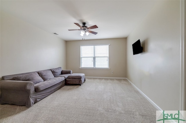 living room featuring light carpet and ceiling fan