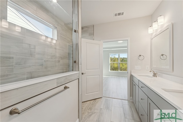 bathroom featuring vanity and a skylight