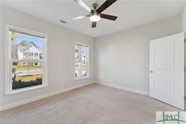 carpeted empty room with ceiling fan