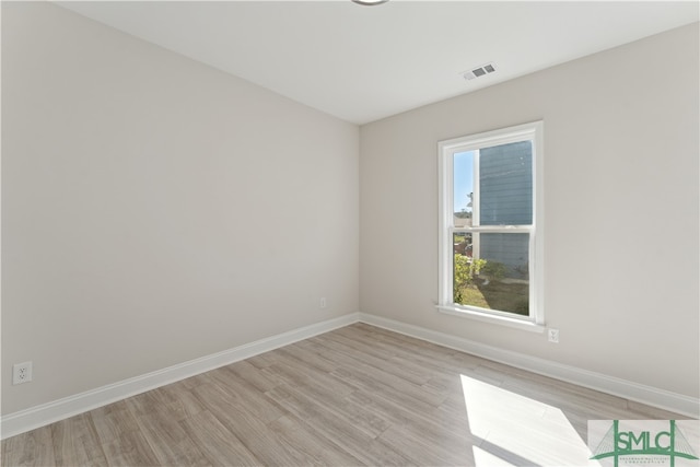 spare room featuring light wood-type flooring