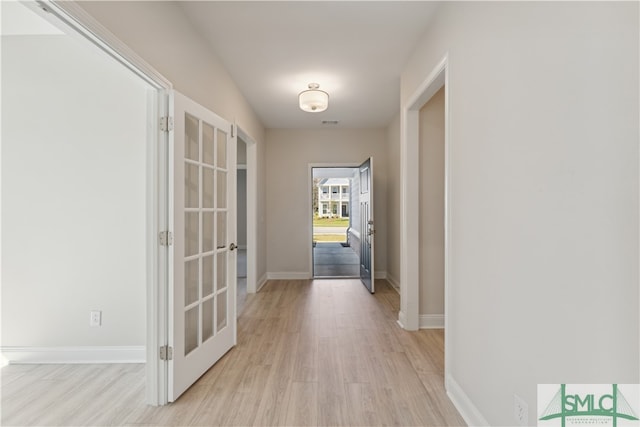 corridor featuring light hardwood / wood-style flooring