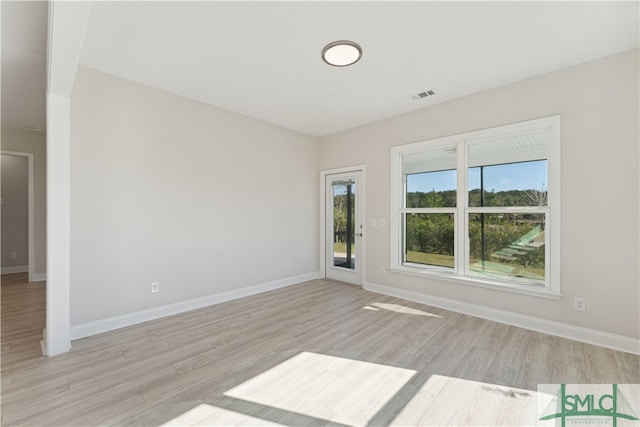 spare room with light hardwood / wood-style floors