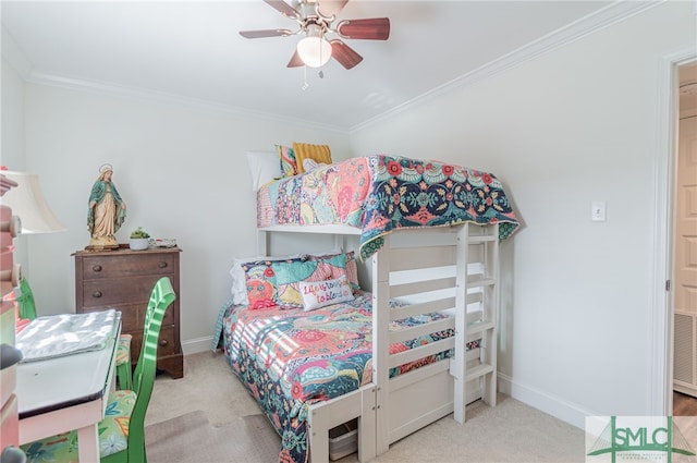 carpeted bedroom featuring ceiling fan and crown molding