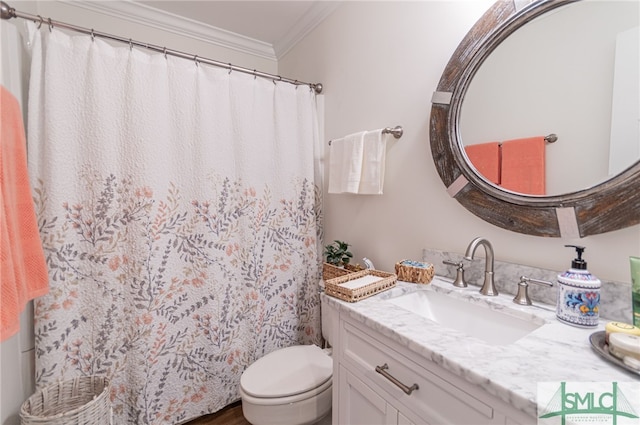 bathroom featuring vanity, toilet, and ornamental molding