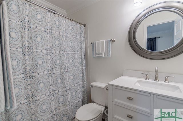 bathroom with vanity, toilet, and ornamental molding