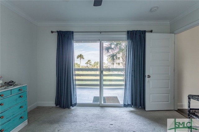 interior space with light carpet, ceiling fan, and ornamental molding