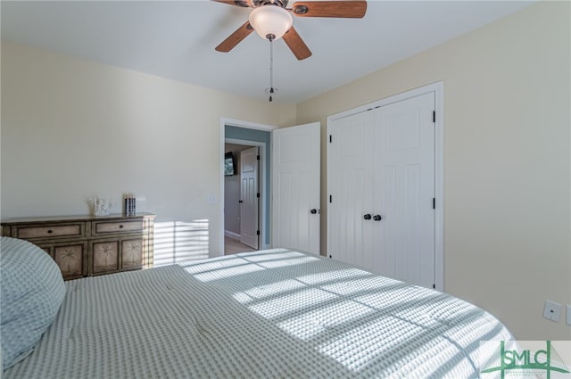 bedroom with ceiling fan and a closet