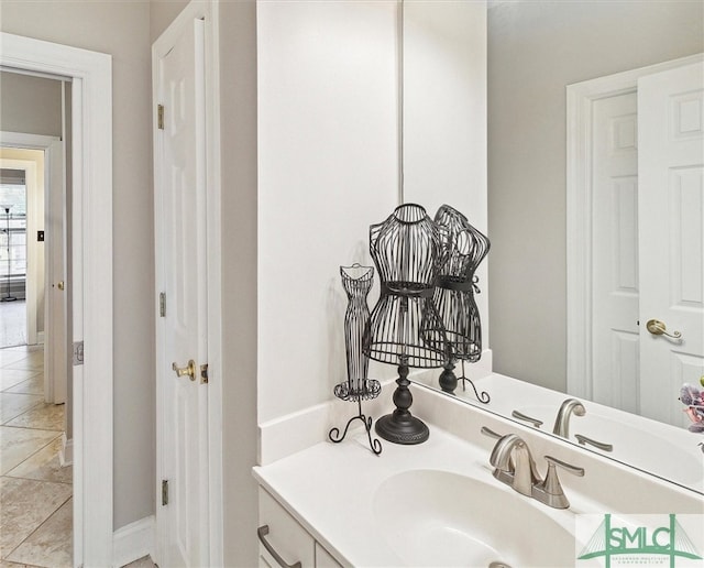 bathroom featuring tile patterned flooring and vanity