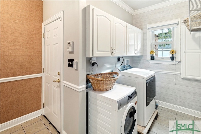 laundry room with separate washer and dryer, crown molding, light tile patterned floors, and cabinets