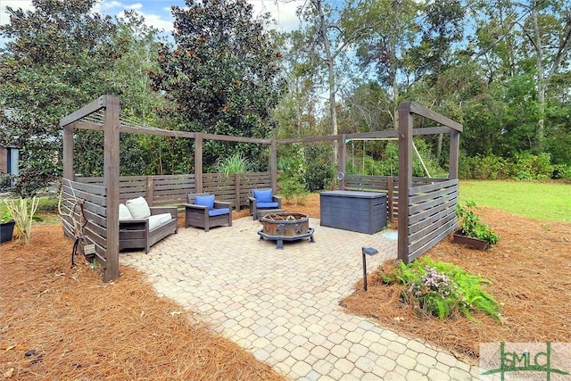 view of patio / terrace featuring an outdoor fire pit