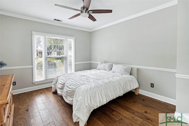 bedroom with ceiling fan, crown molding, and dark hardwood / wood-style floors