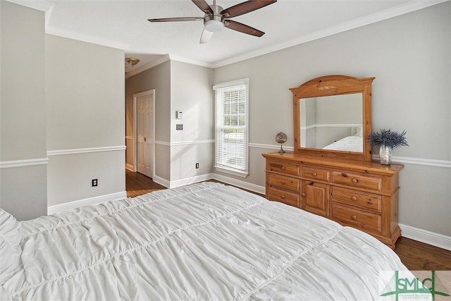 bedroom with crown molding, ceiling fan, and hardwood / wood-style flooring