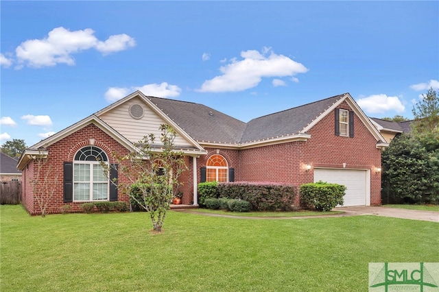 view of property with a front yard and a garage