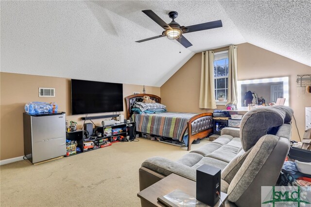 bedroom featuring ceiling fan, carpet floors, a textured ceiling, and lofted ceiling