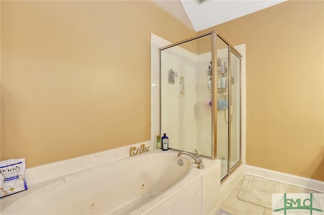 bathroom with tile patterned flooring, separate shower and tub, and vaulted ceiling