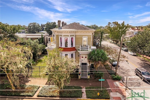 view of front of home featuring a balcony