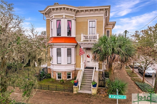 italianate-style house with a balcony