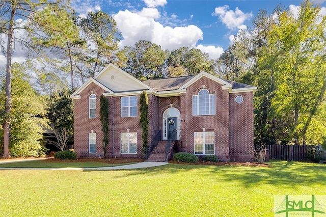 split foyer home with a front lawn