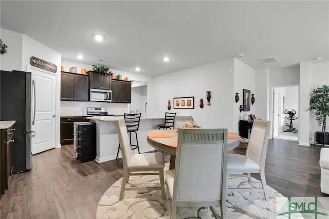 dining room with dark wood-type flooring