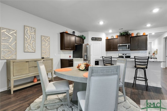 dining area featuring dark hardwood / wood-style floors