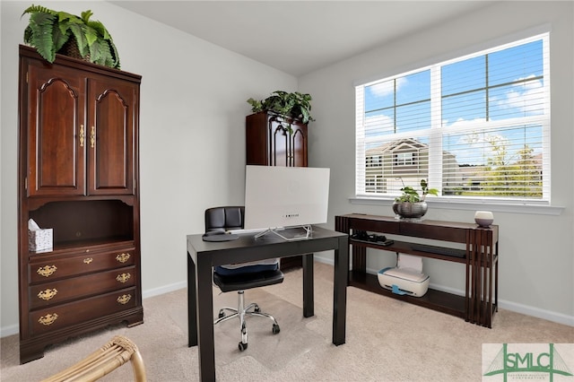 carpeted home office featuring plenty of natural light