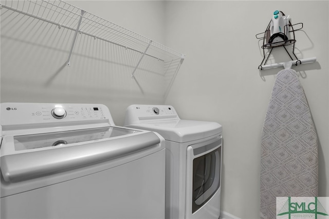 clothes washing area featuring washing machine and dryer