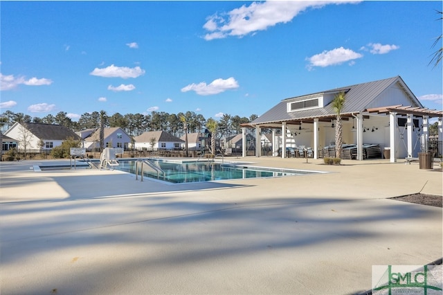 view of pool featuring a patio and ceiling fan