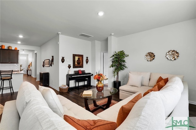 living room featuring dark wood-type flooring