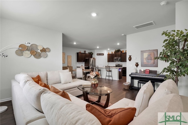 living room featuring dark hardwood / wood-style flooring