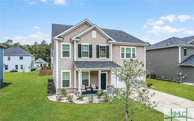 craftsman house with an outdoor hangout area, a front lawn, and cooling unit