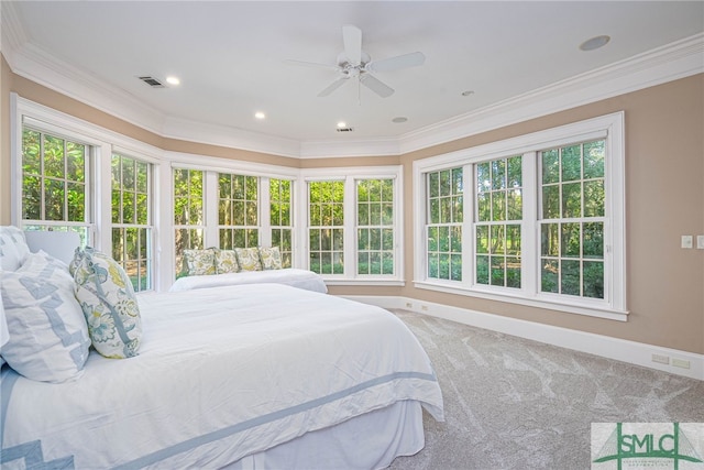 bedroom featuring multiple windows, ceiling fan, and carpet floors