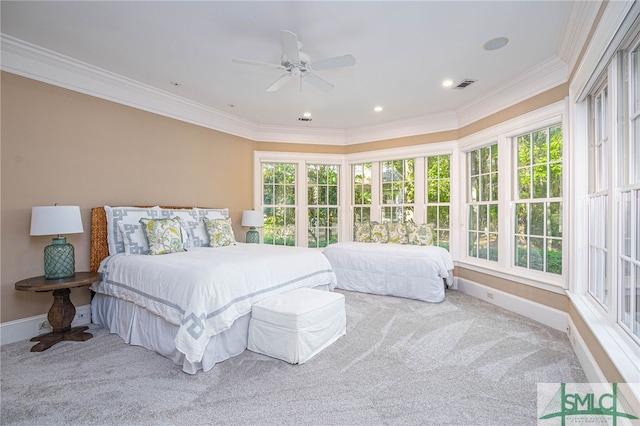 bedroom featuring ceiling fan, crown molding, and carpet floors