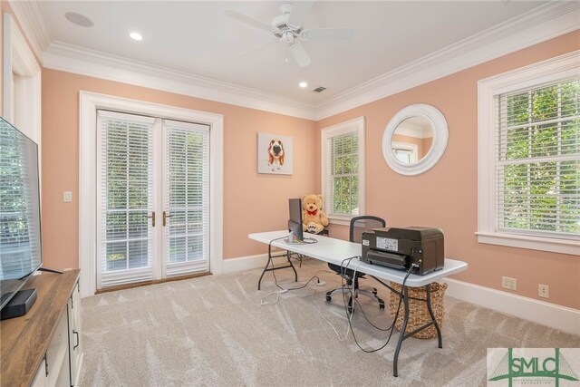 carpeted office with ceiling fan, plenty of natural light, and ornamental molding