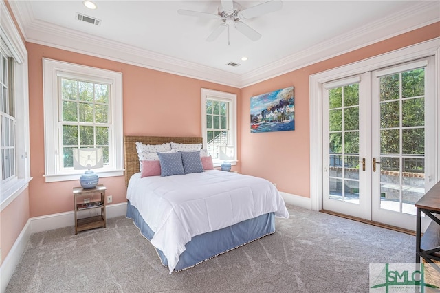 carpeted bedroom featuring multiple windows, ceiling fan, and french doors