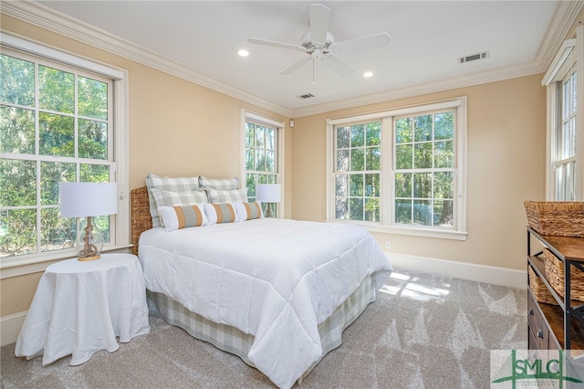 bedroom featuring multiple windows and ceiling fan