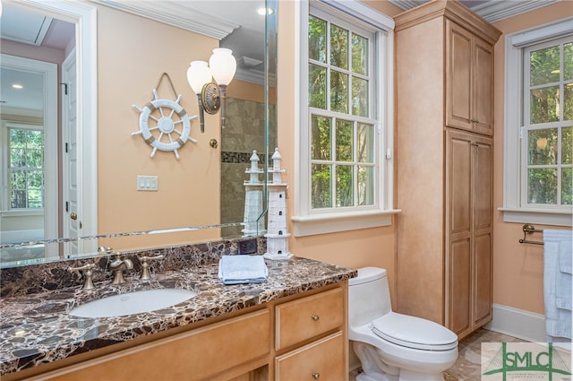 bathroom featuring tile patterned floors, toilet, vanity, and ornamental molding