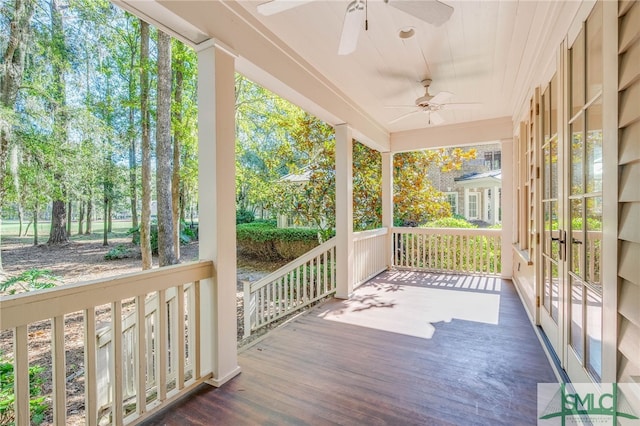 wooden deck with ceiling fan and covered porch