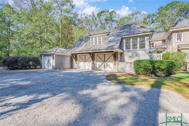 tudor-style house with a garage