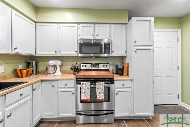 kitchen featuring white cabinetry and stainless steel appliances