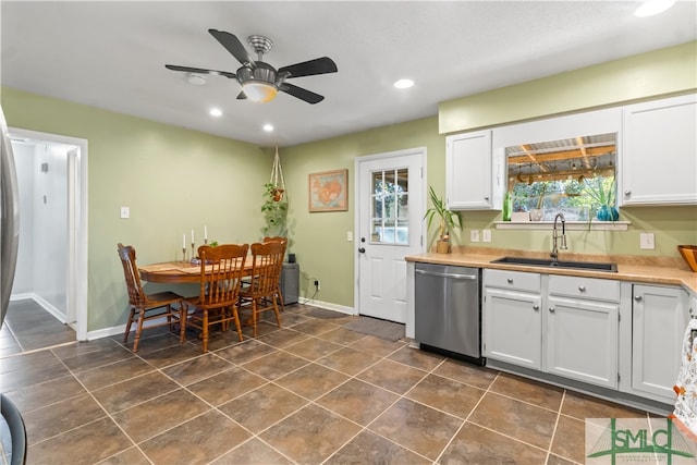 kitchen with dishwasher, white cabinetry, ceiling fan, and sink