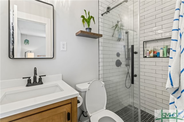 bathroom with vanity, curtained shower, and toilet