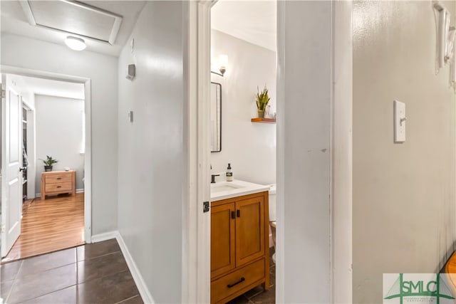 bathroom featuring toilet, vanity, and tile patterned floors