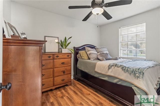 bedroom featuring ceiling fan and hardwood / wood-style flooring